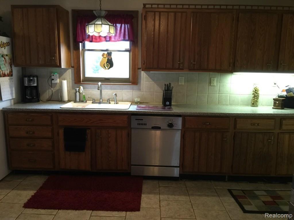2659 Byron Road Howell, MI 48855 - Photo 4 of 45 Under cabinet lighting and stainless dishwasher