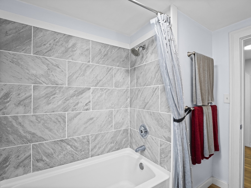 354 Townsend Road Groton, MA 01450 - Photo 13 of 39 a bathroom with a bathtub and a shower