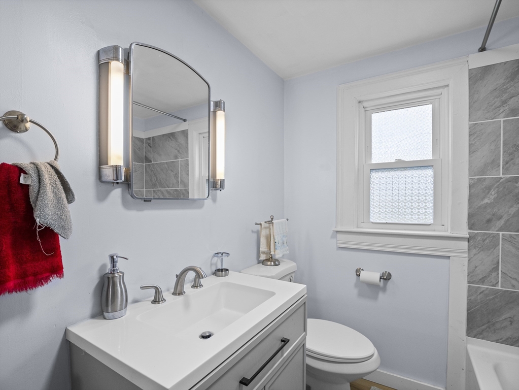 354 Townsend Road Groton, MA 01450 - Photo 15 of 39 a bathroom with a toilet sink and mirror