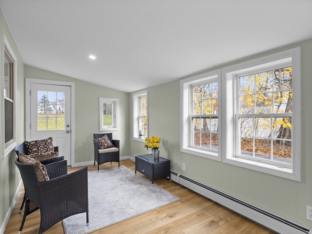 354 Townsend Road Groton, MA 01450 - Photo 24 of 39 a living room with furniture and wooden floor