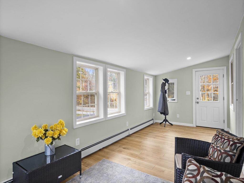 354 Townsend Road Groton, MA 01450 - Photo 25 of 39 a living room with furniture wall and a window