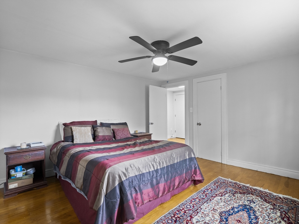 354 Townsend Road Groton, MA 01450 - Photo 33 of 39 a bedroom with a bed and a chandelier