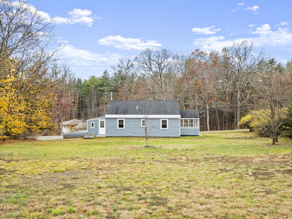 354 Townsend Road Groton, MA 01450 - Photo 38 of 39 a house view with swimming pool and trees in the background
