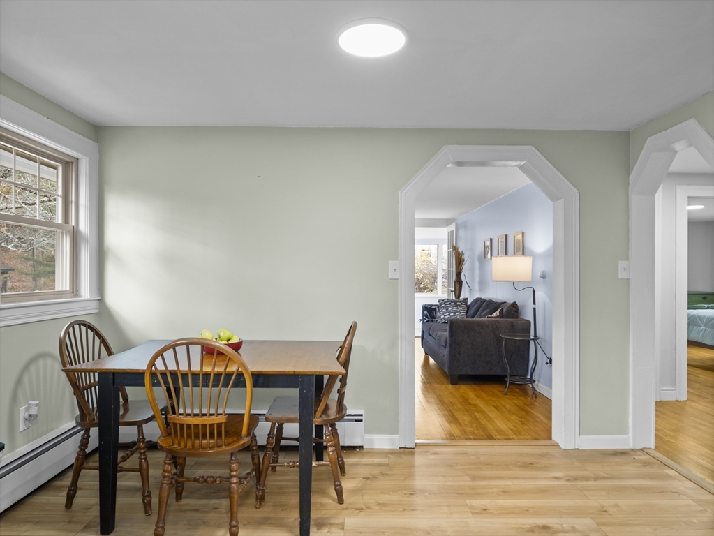 354 Townsend Road Groton, MA 01450 - Photo 6 of 39 a view of a dining room with furniture and wooden floor