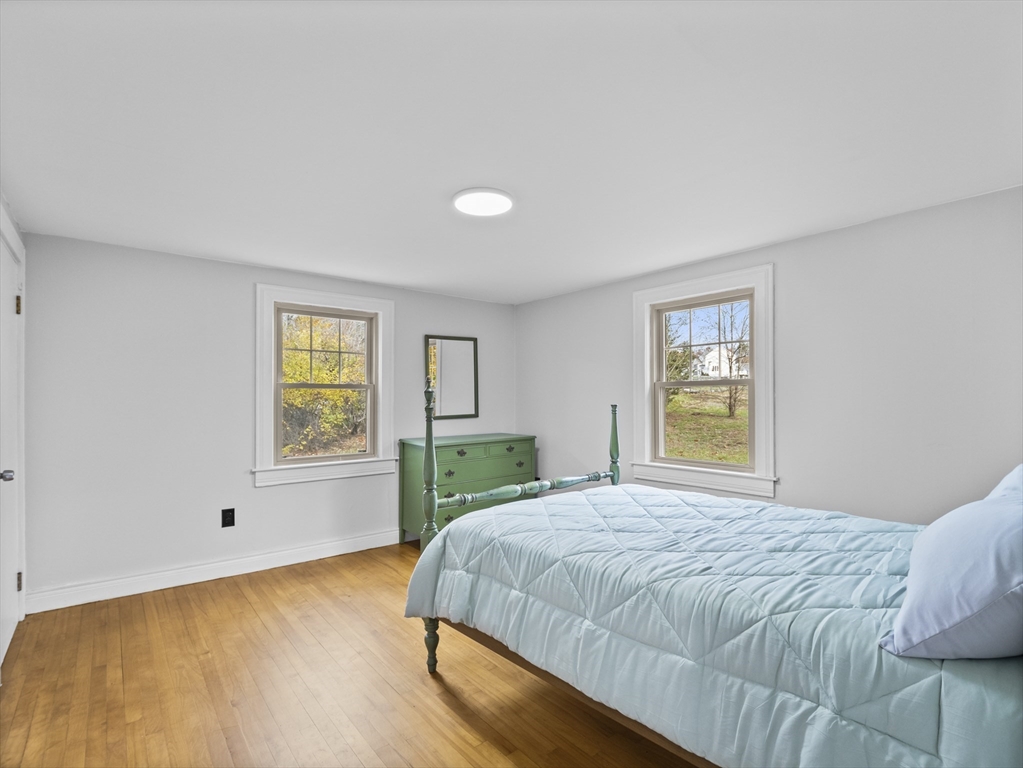 354 Townsend Road Groton, MA 01450 - Photo 9 of 39 a bedroom with a bed and a window