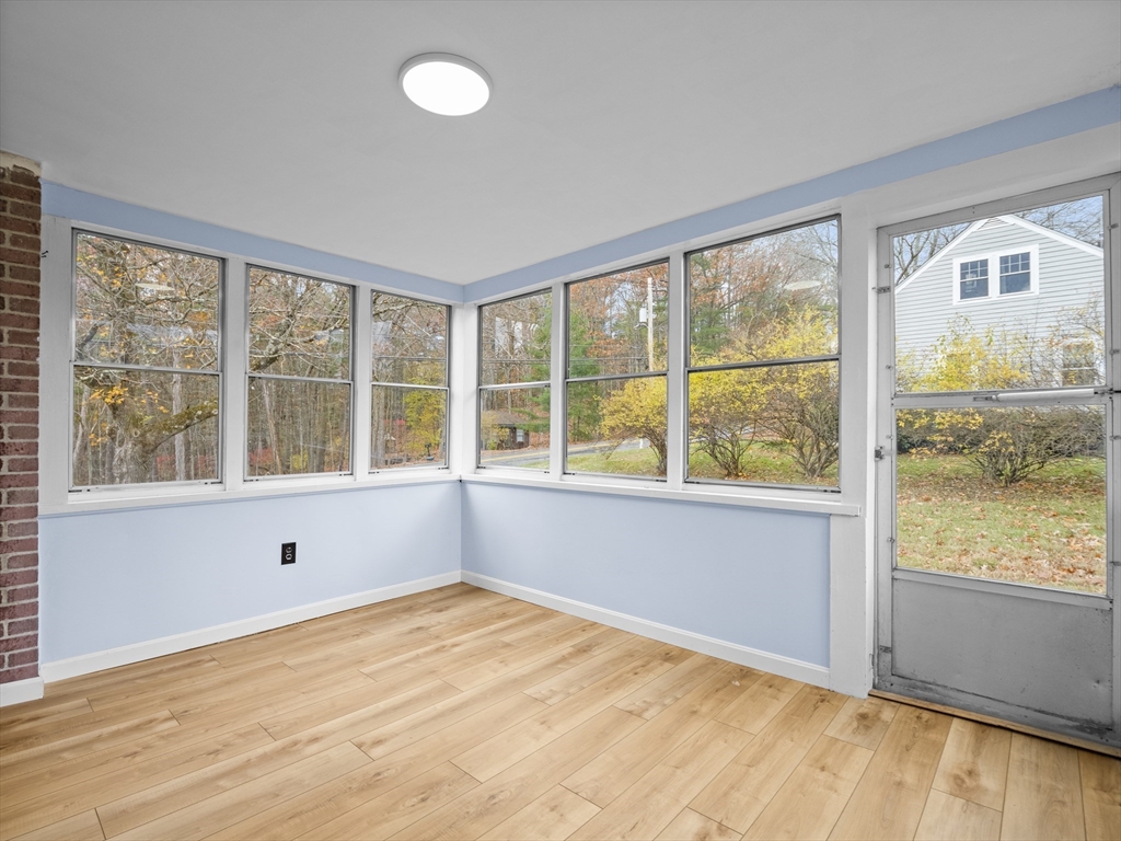 354 Townsend Road Groton, MA 01450 - Photo 10 of 39 a view of an empty room with wooden floor and a window