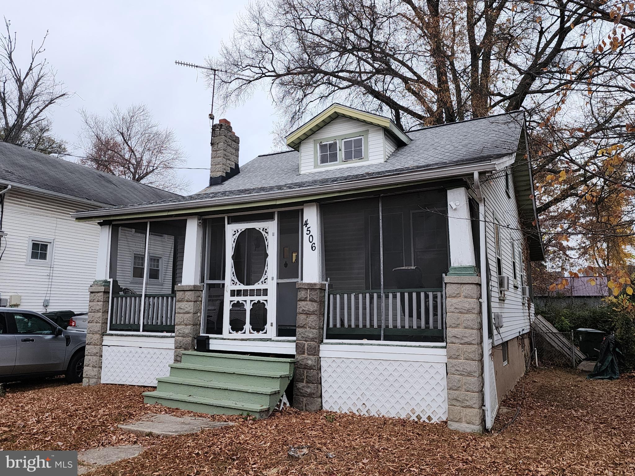 Charming bungalow with inviting porch.