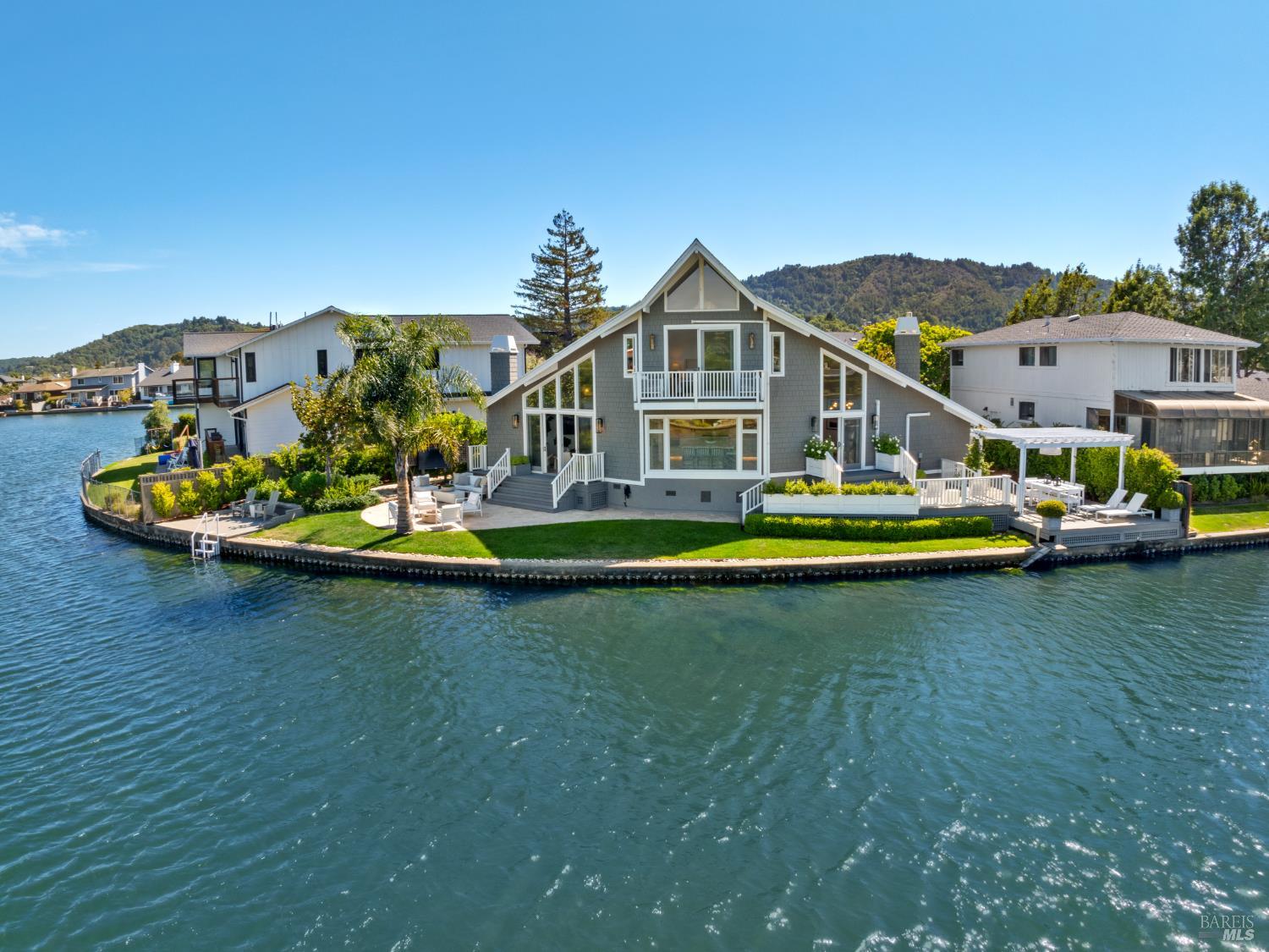 91 Corte Del Bayo Larkspur, CA 94939 - Photo 1 of 1 a front view of a house with a garden and houses