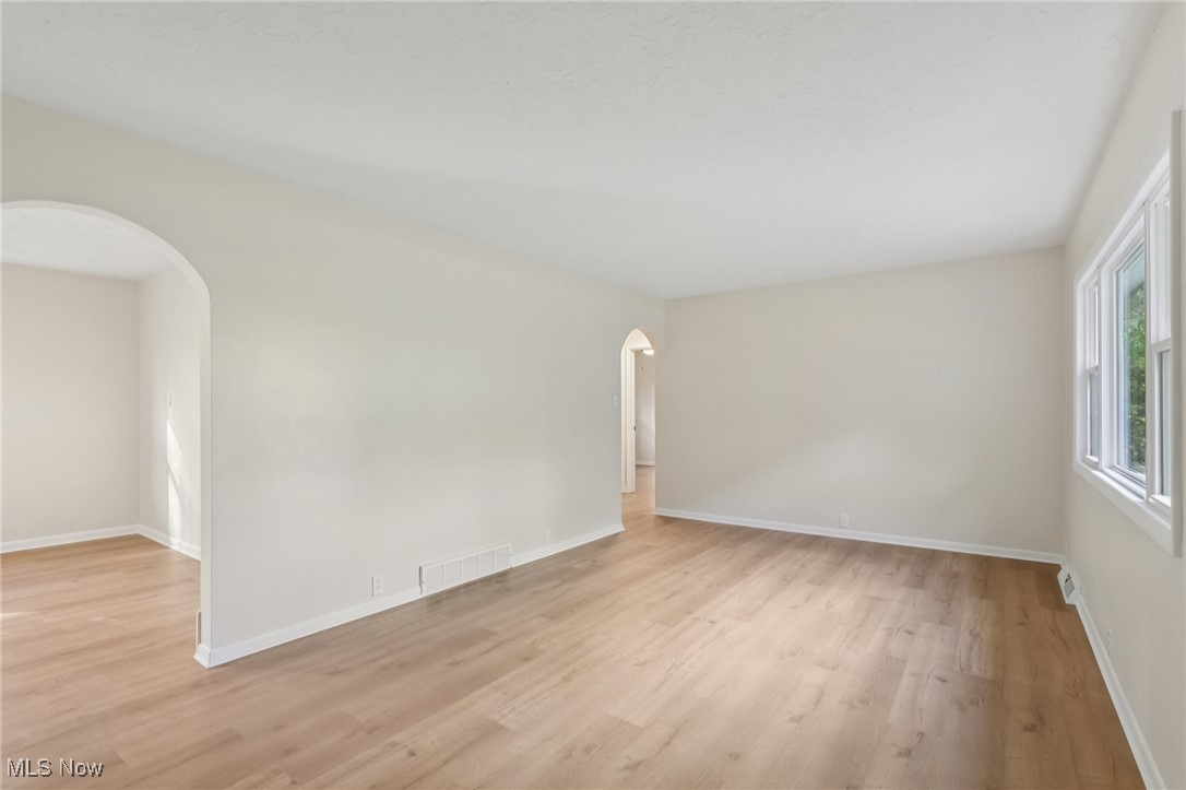 50963 Becker Road Oberlin, OH 44074 - Photo 12 of 37 Unfurnished room with light wood finished floors and arched walkways