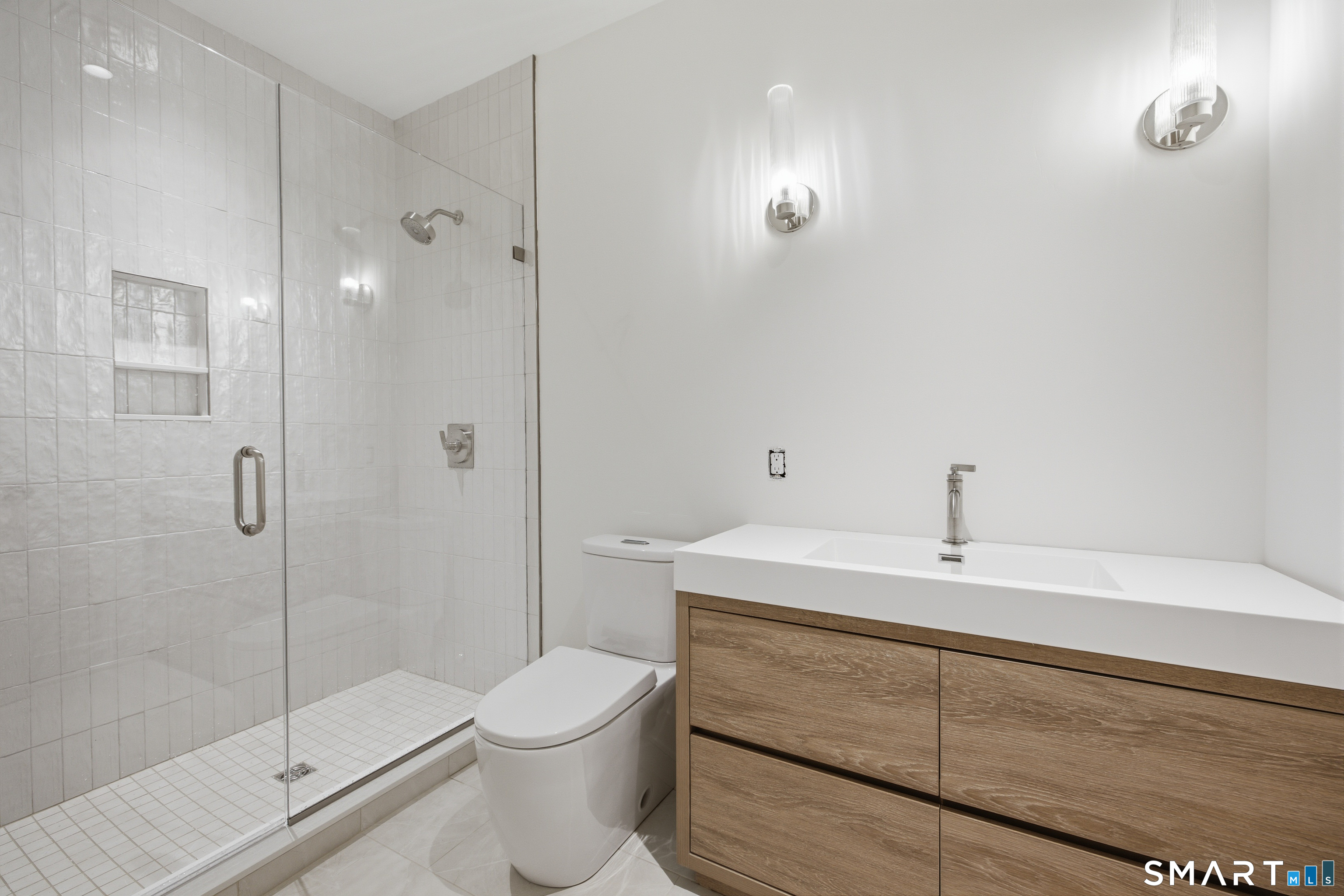 2 Windy Hill Road Westport, CT 06880 - Photo 37 of 40 a bathroom with a sink a toilet and shower