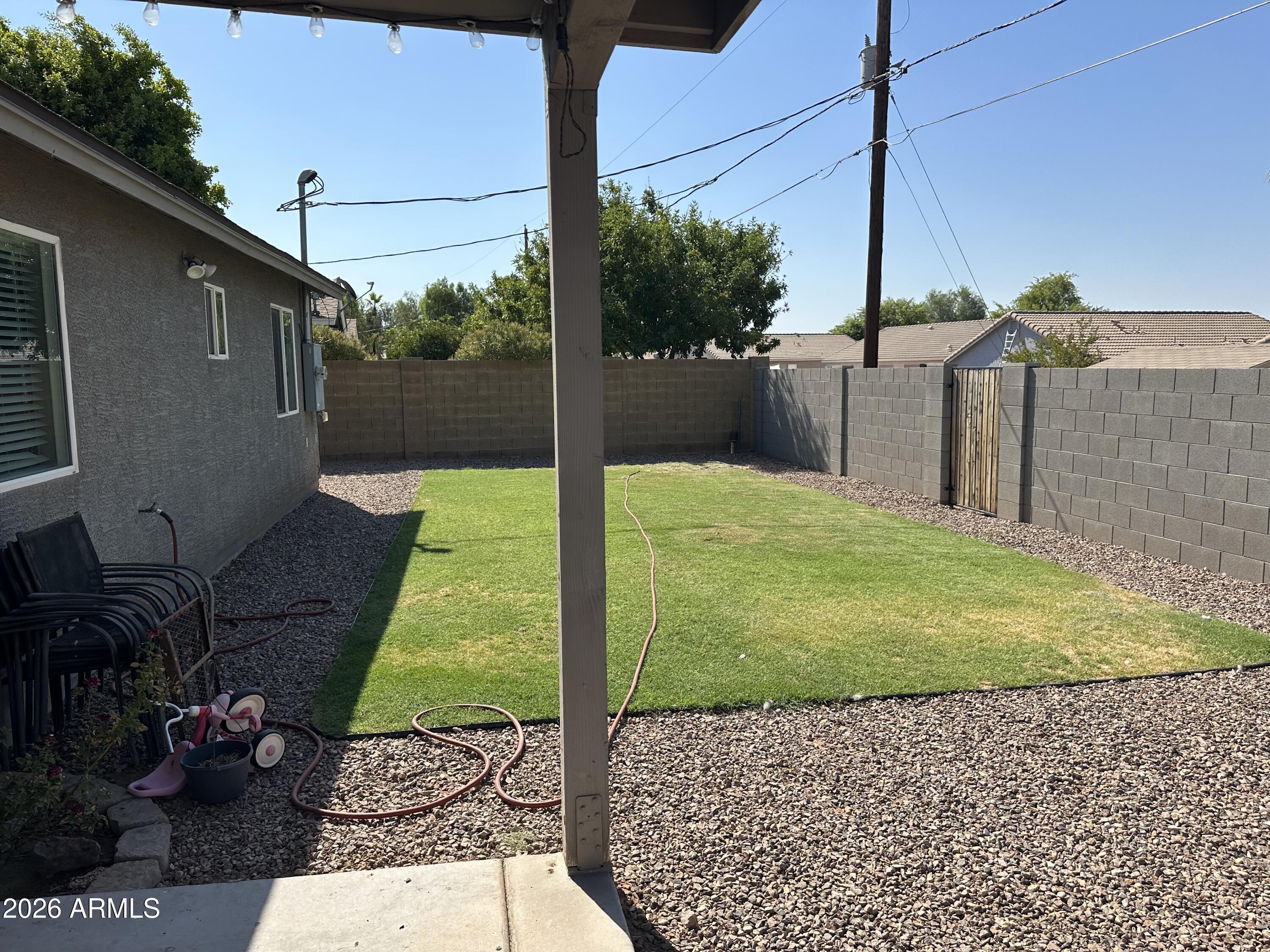 1059 West 5th Avenue Apache Junction, AZ 85120 - Photo 14 of 14 a view of a backyard with potted plants