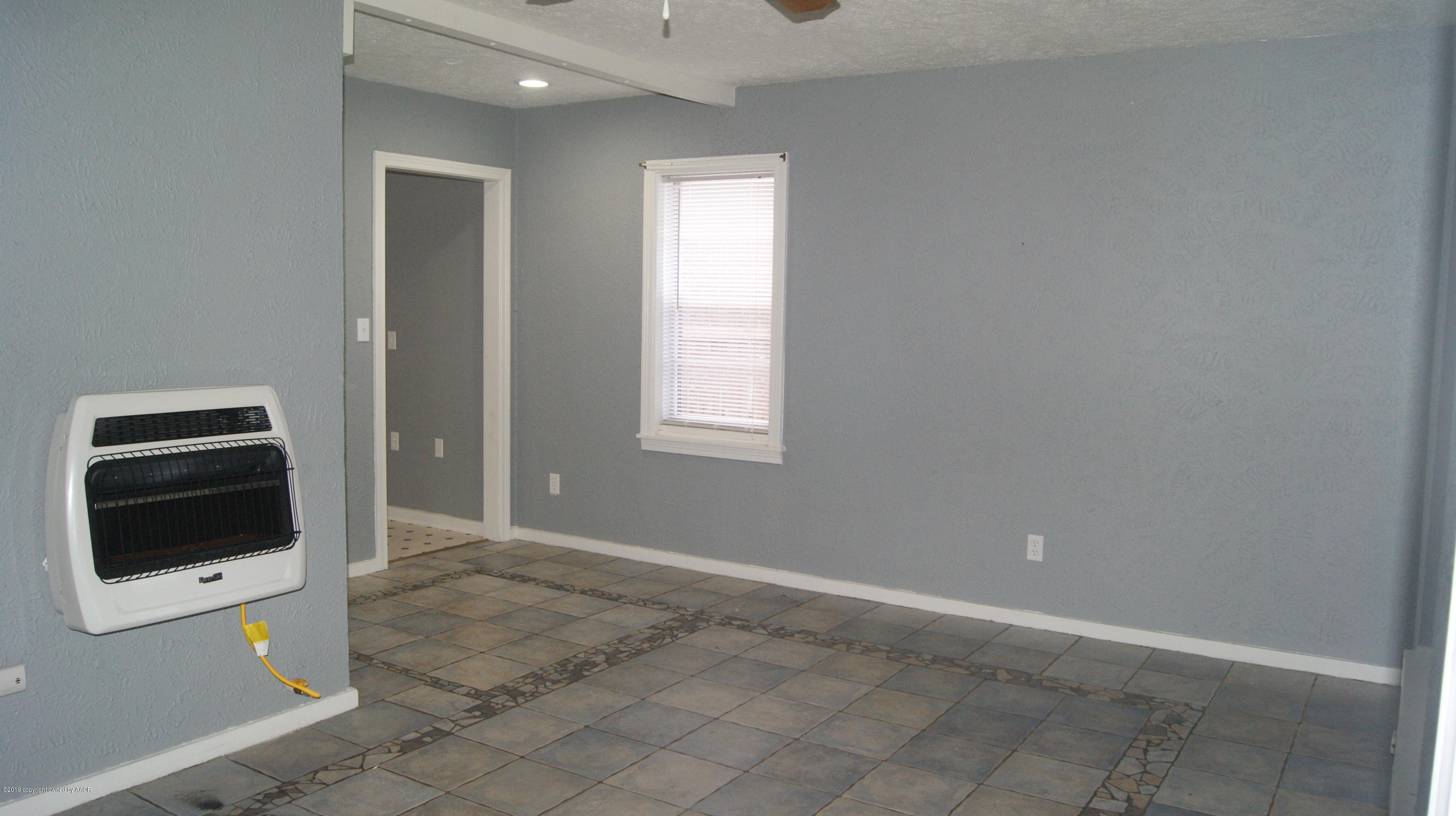 3604 South Ong Street Amarillo, TX 79110 - Photo 8 of 38 wooden floor and window in a room