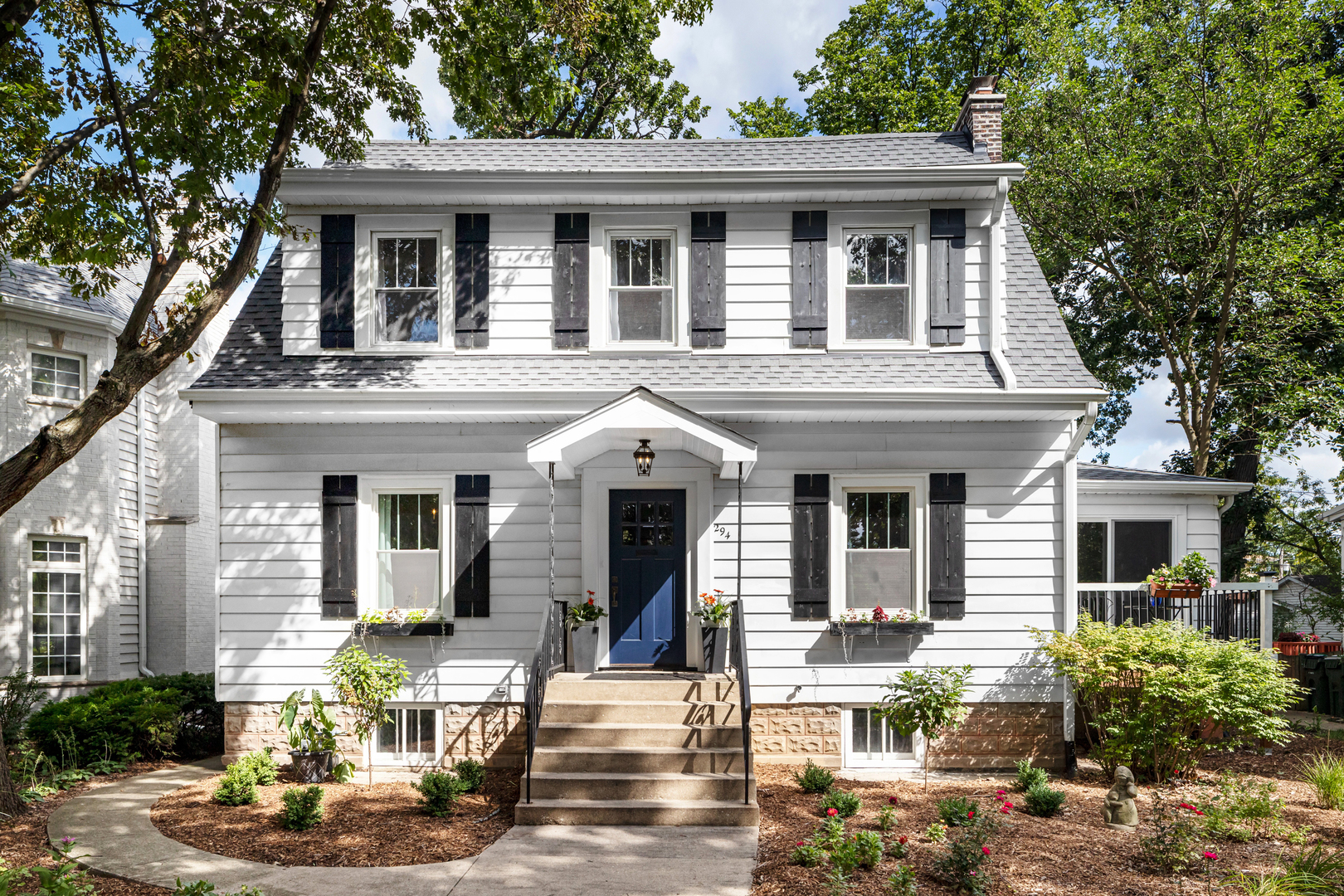 294 Maplewood Road Riverside, IL 60546 - Photo 2 of 31 a front view of a house with garden