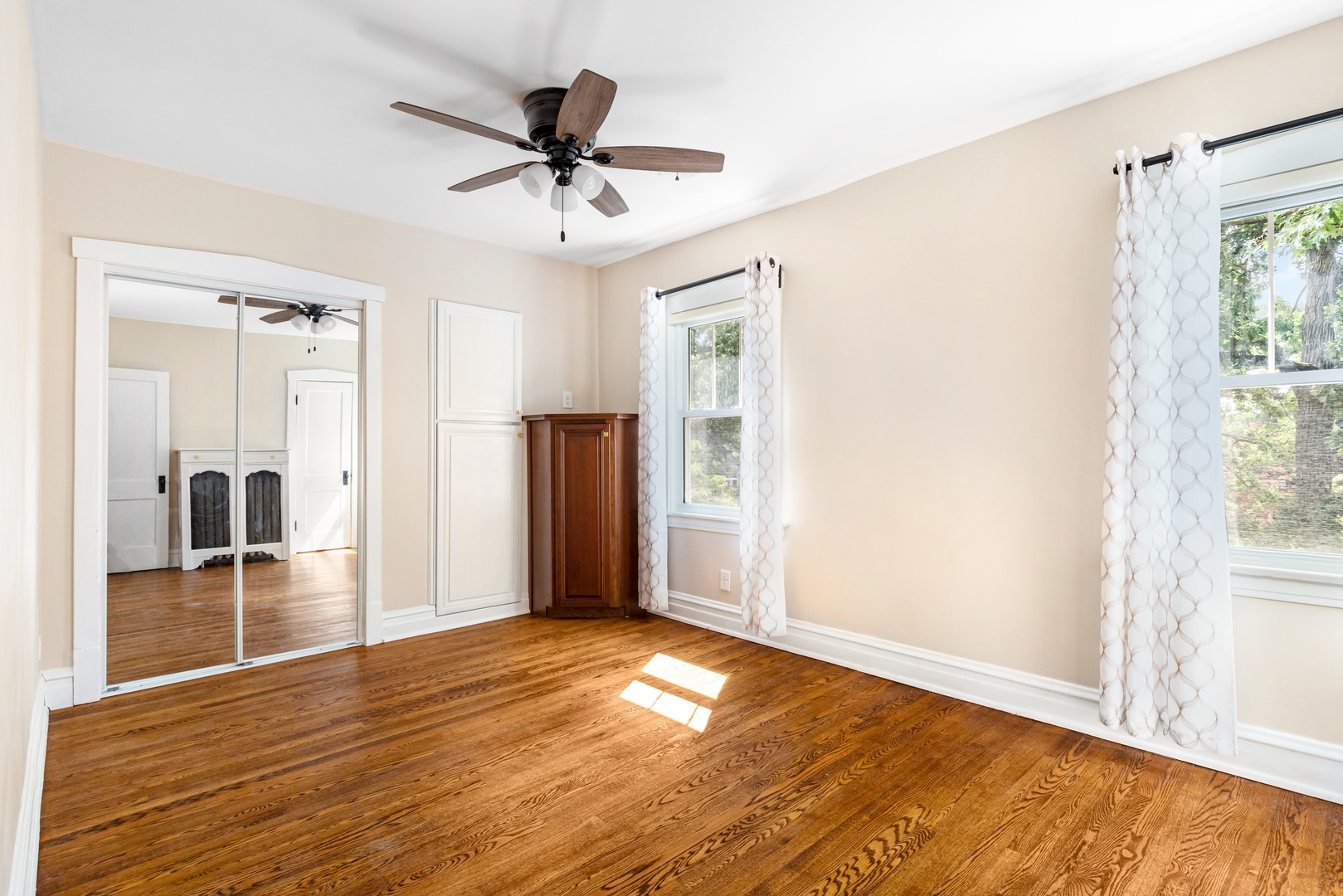 294 Maplewood Road Riverside, IL 60546 - Photo 18 of 31 a view of empty room with wooden floor and fan
