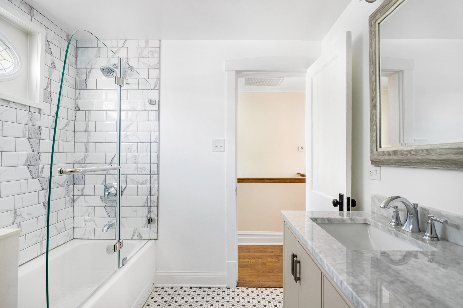294 Maplewood Road Riverside, IL 60546 - Photo 22 of 31 a bathroom with a granite countertop sink a bathtub and a shower