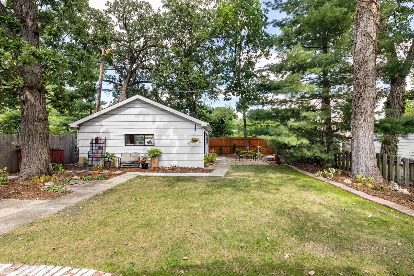294 Maplewood Road Riverside, IL 60546 - Photo 24 of 31 a view of a house with backyard and a tree
