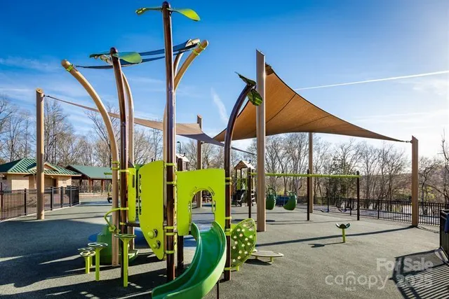 a view of a swimming pool with a yard