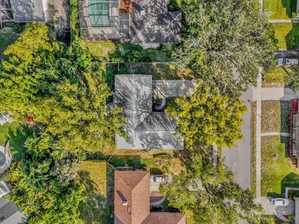 aerial view of a house with a yard
