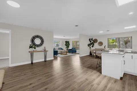 a view of a living room and hardwood floor