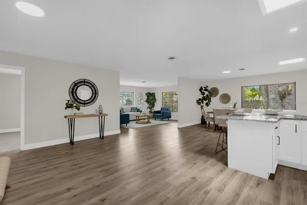 a view of a living room and hardwood floor