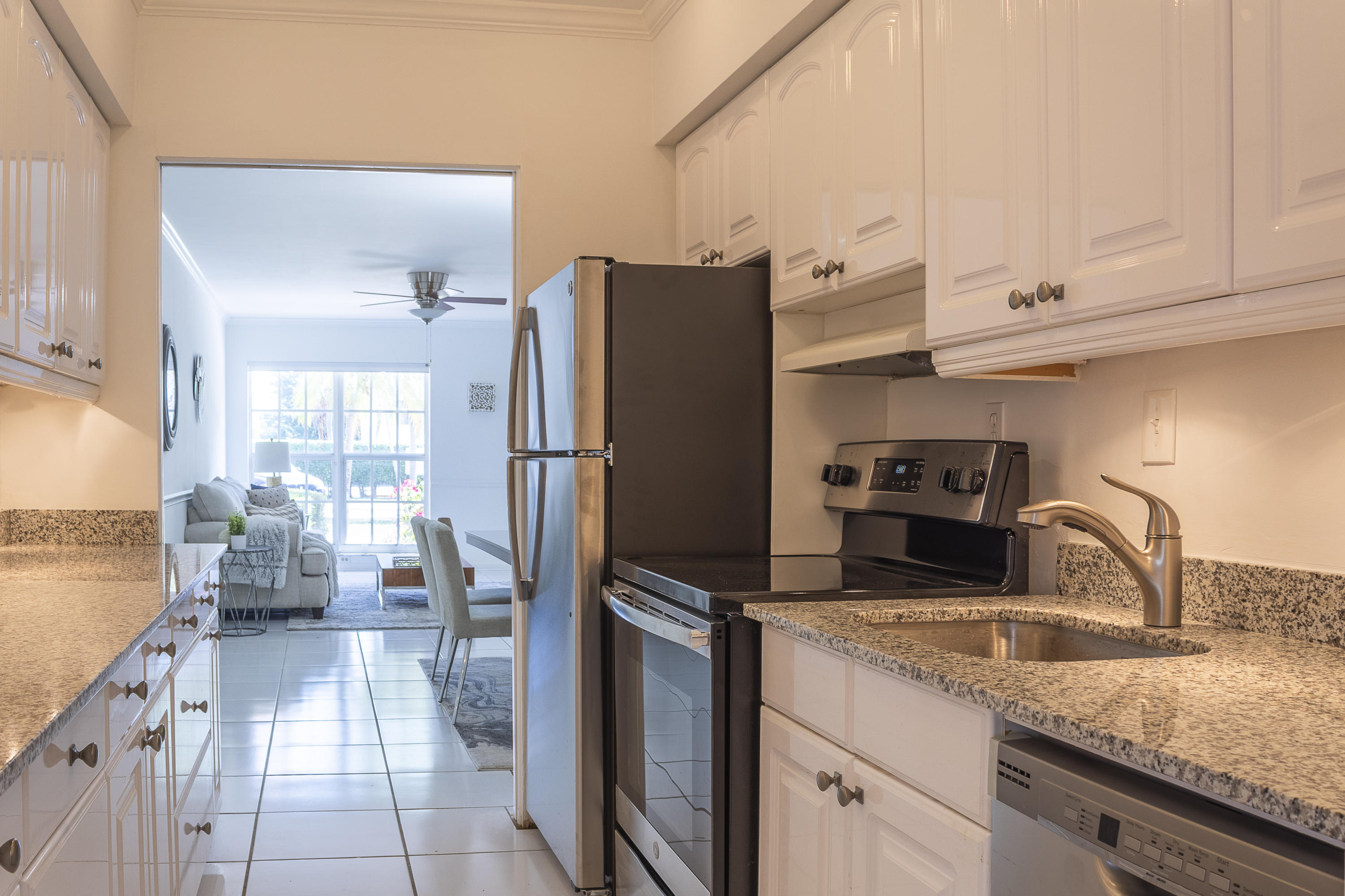 770 East Camino Real, Unit 60 Boca Raton, FL 33432 - Photo 12 of 40 a kitchen with refrigerator and cabinets