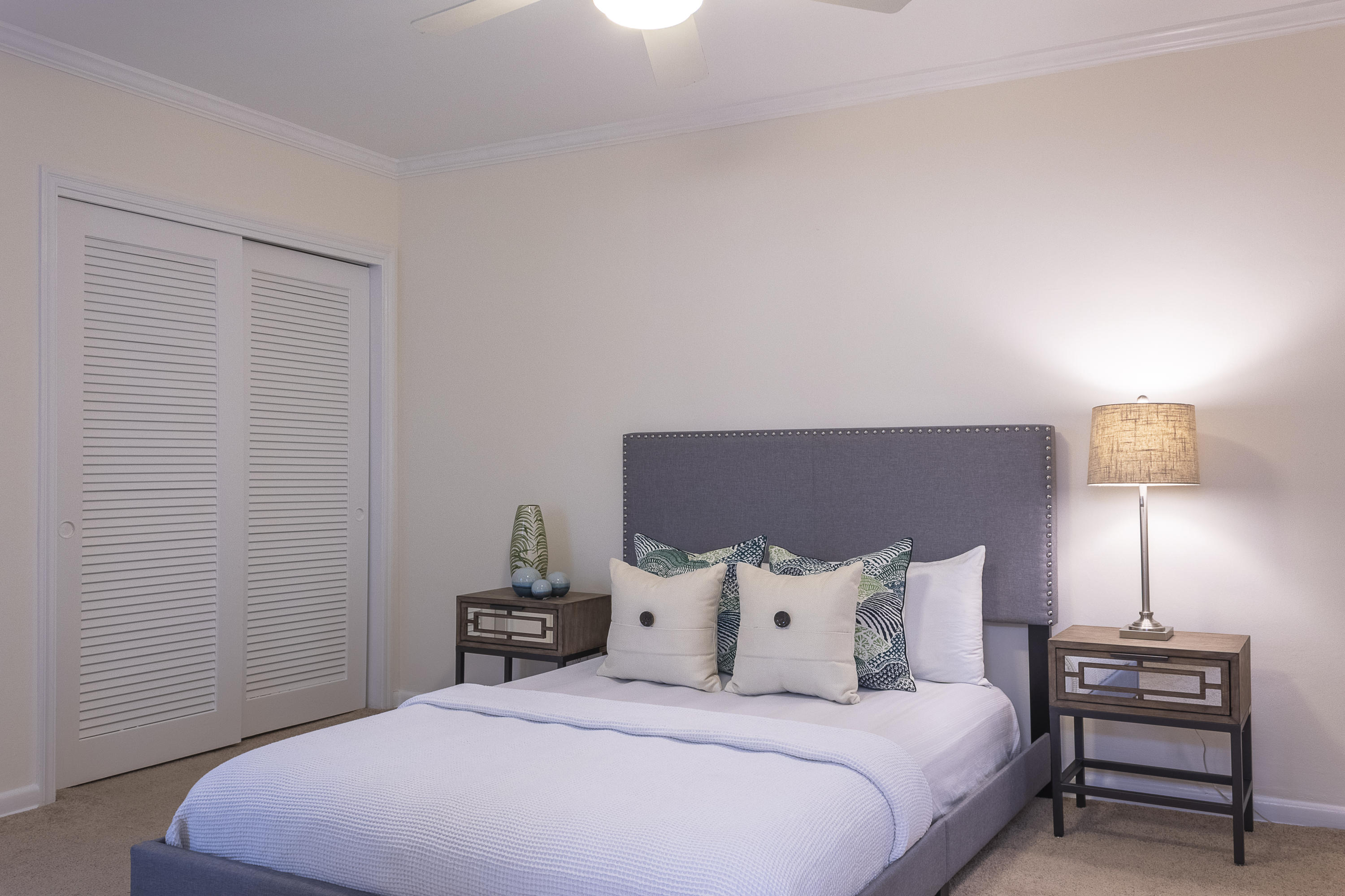 770 East Camino Real, Unit 60 Boca Raton, FL 33432 - Photo 14 of 40 a bedroom with a bed and a night stand