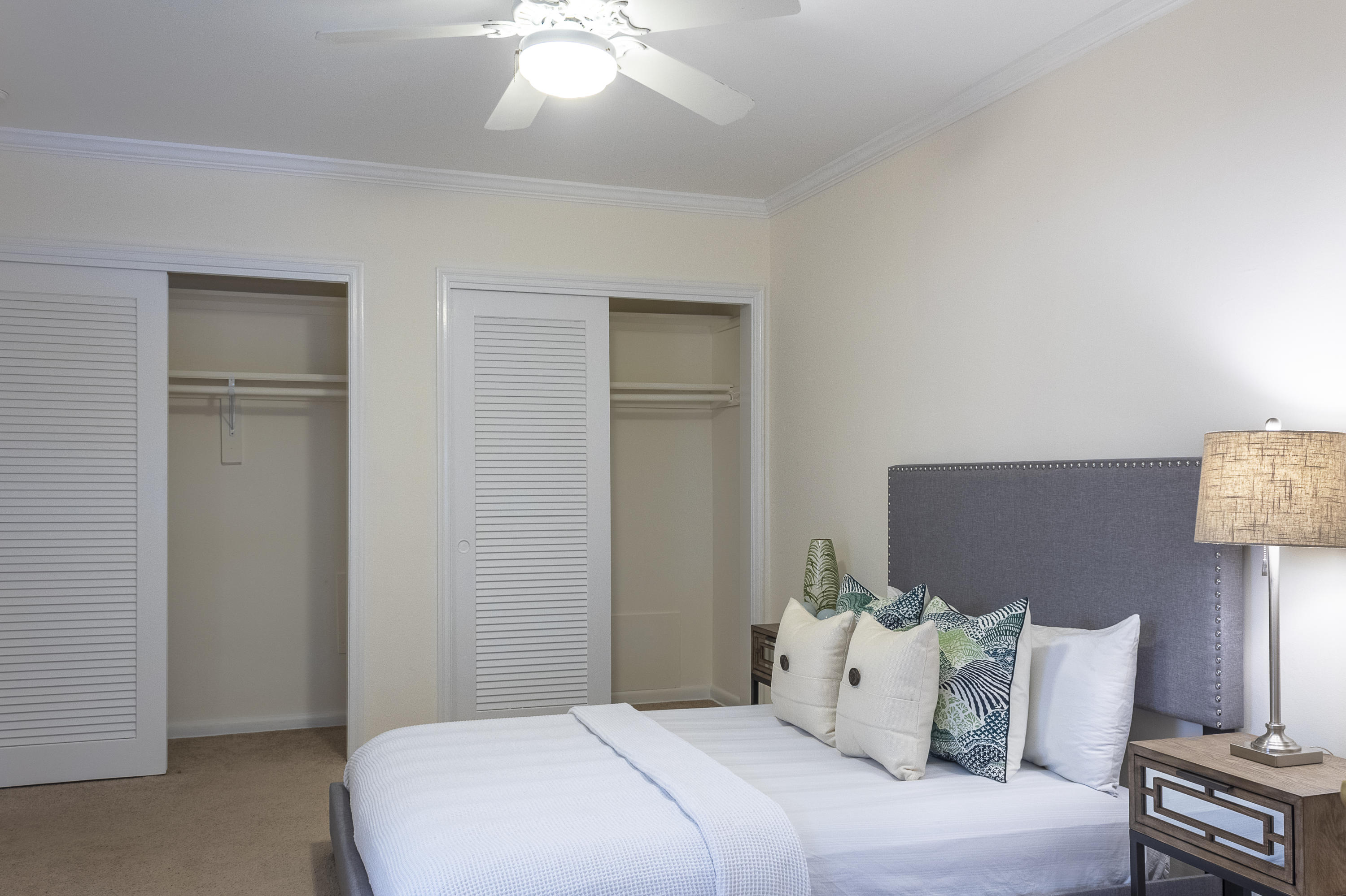 770 East Camino Real, Unit 60 Boca Raton, FL 33432 - Photo 15 of 40 a bedroom with a bed and a lamp