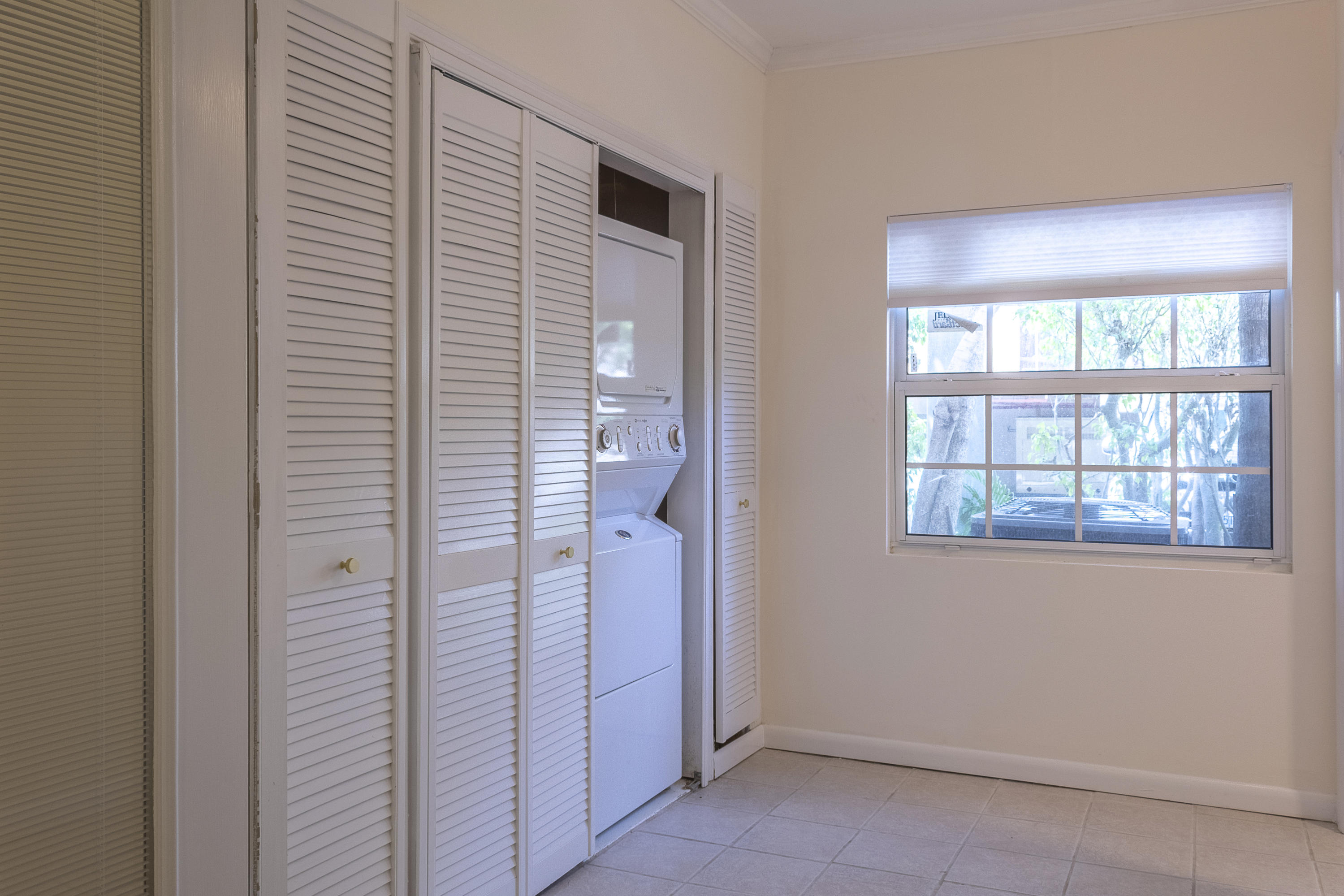 770 East Camino Real, Unit 60 Boca Raton, FL 33432 - Photo 25 of 40 an entryway with a window
