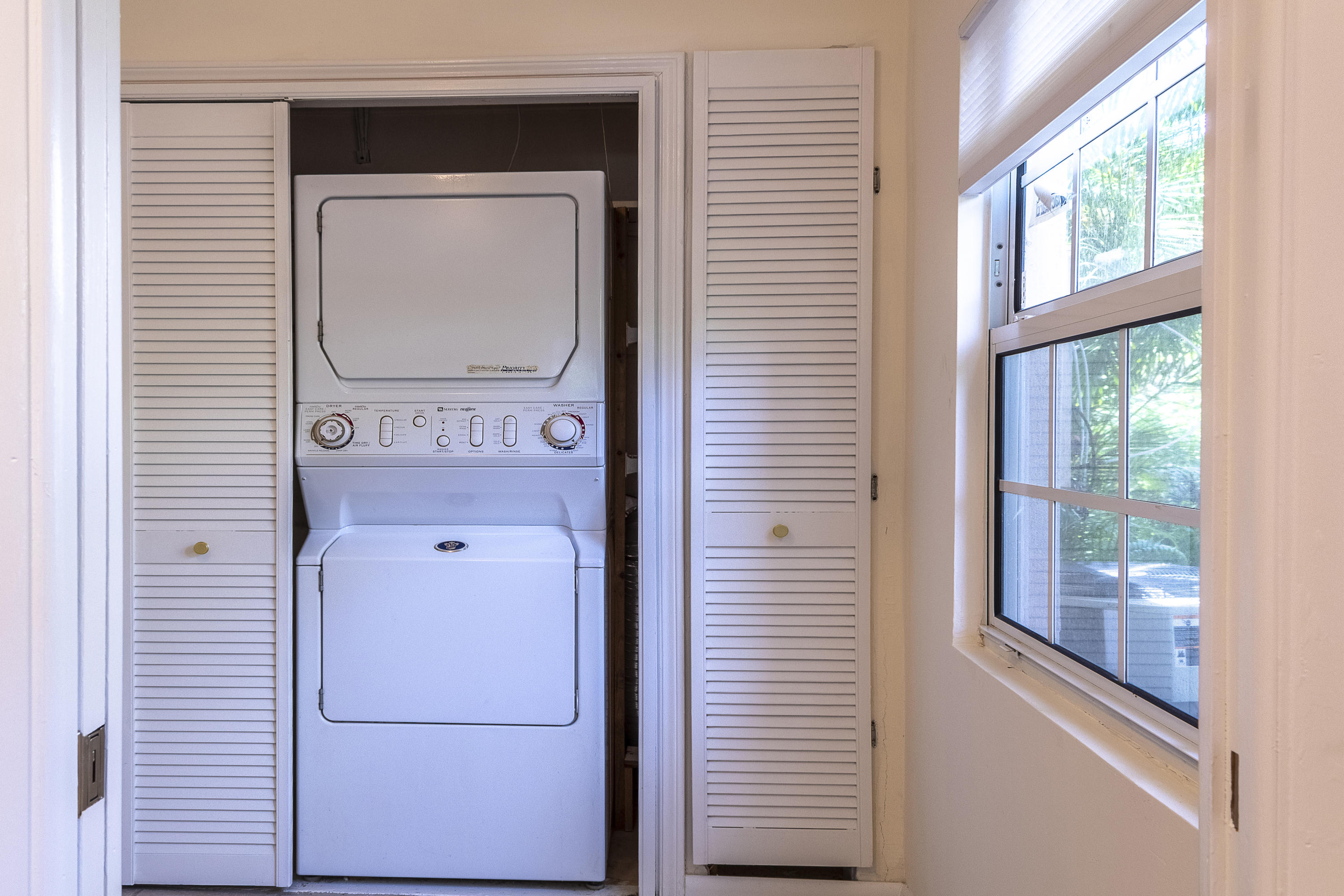 770 East Camino Real, Unit 60 Boca Raton, FL 33432 - Photo 26 of 40 a utility room with a washer and dryer