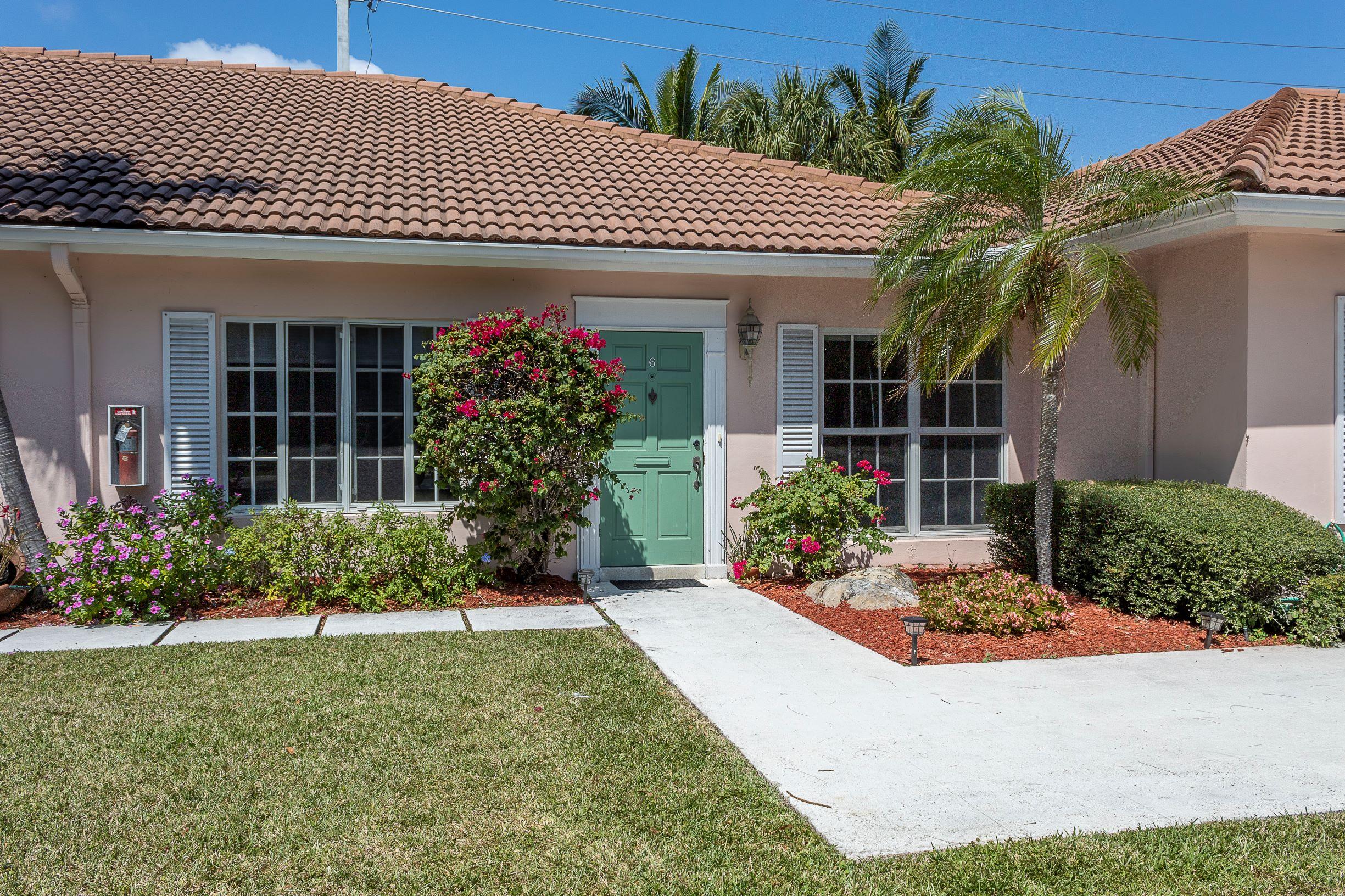 770 East Camino Real, Unit 60 Boca Raton, FL 33432 - Photo 3 of 40 front view of a house with a yard
