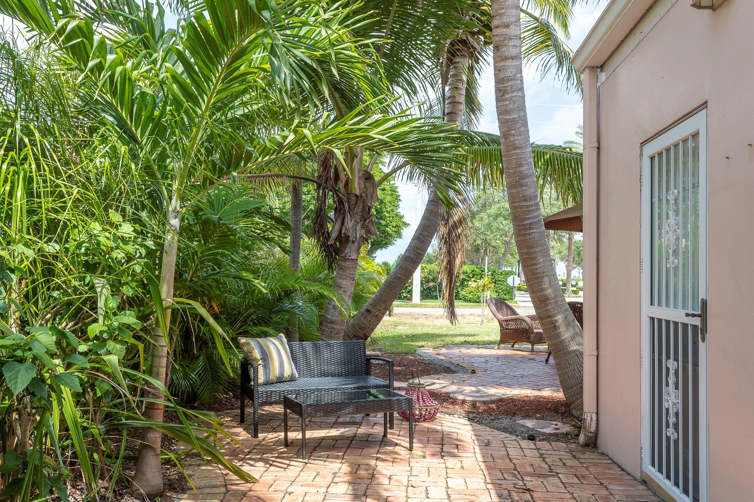 770 East Camino Real, Unit 60 Boca Raton, FL 33432 - Photo 32 of 40 a view of outdoor space yard and porch