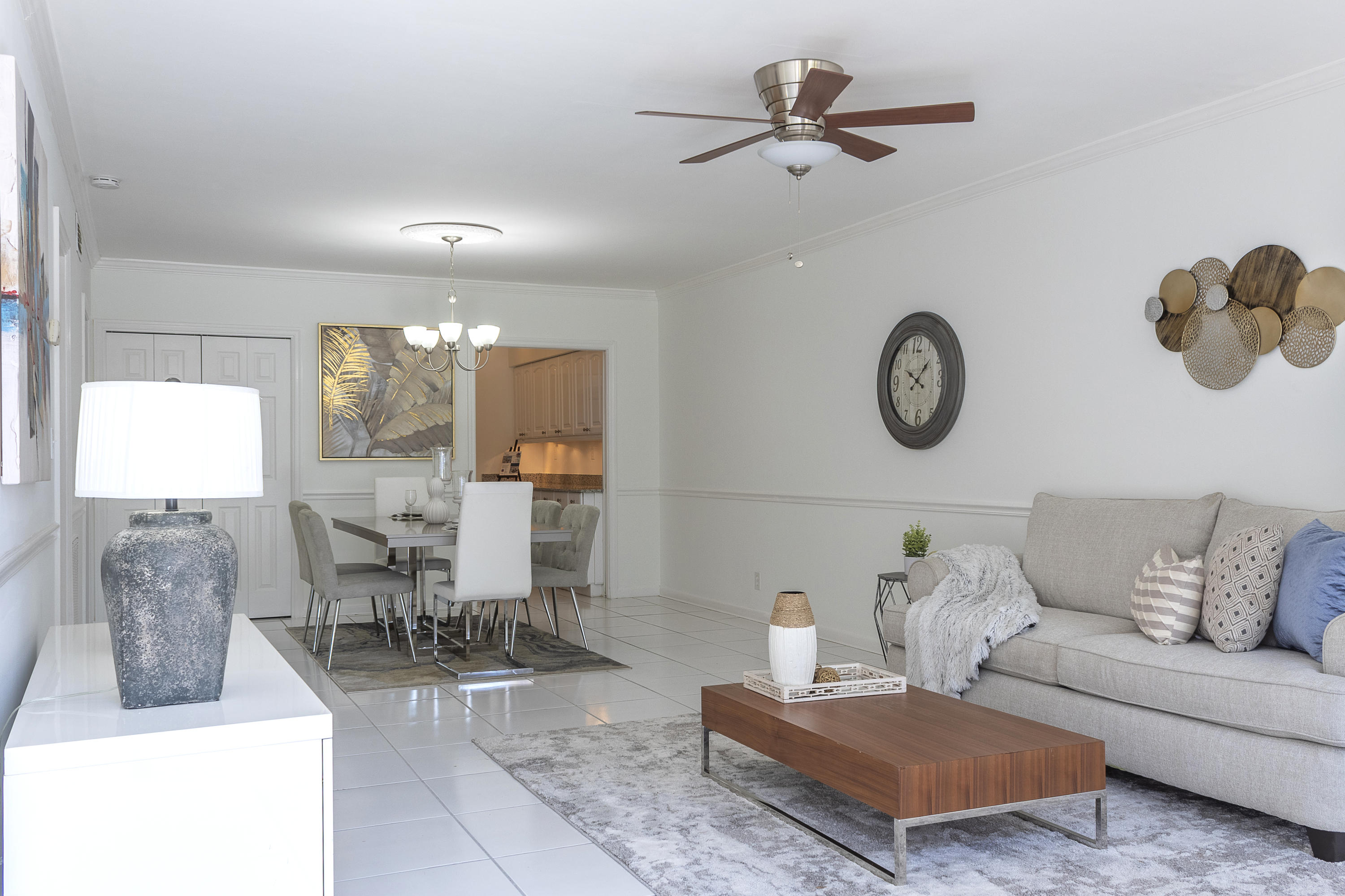 770 East Camino Real, Unit 60 Boca Raton, FL 33432 - Photo 4 of 40 a living room with furniture a rug and a window