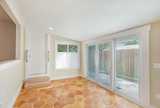a view of an empty room and window