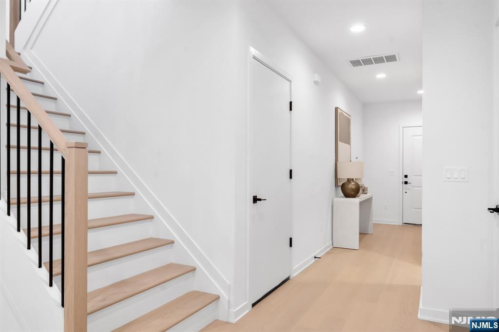 23 Fey Place Oradell, NJ 07649 - Photo 13 of 36 a view of a hallway with wooden floor and entryway