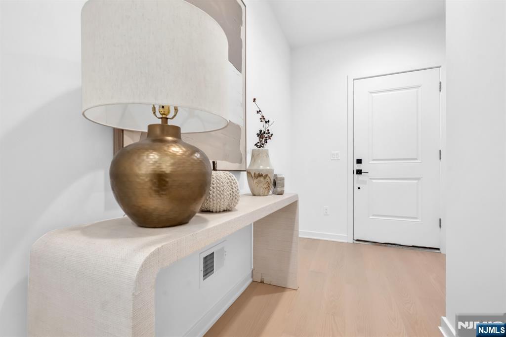 23 Fey Place Oradell, NJ 07649 - Photo 2 of 36 a bathroom with a sink and a mirror