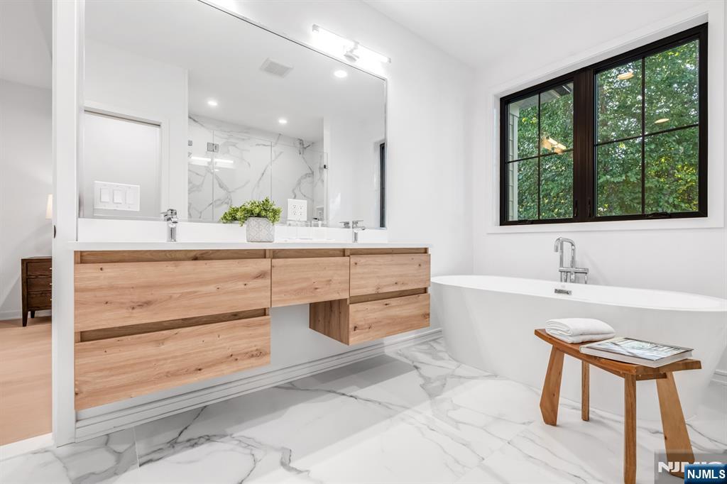 23 Fey Place Oradell, NJ 07649 - Photo 21 of 36 a bathroom with a sink and a bathtub