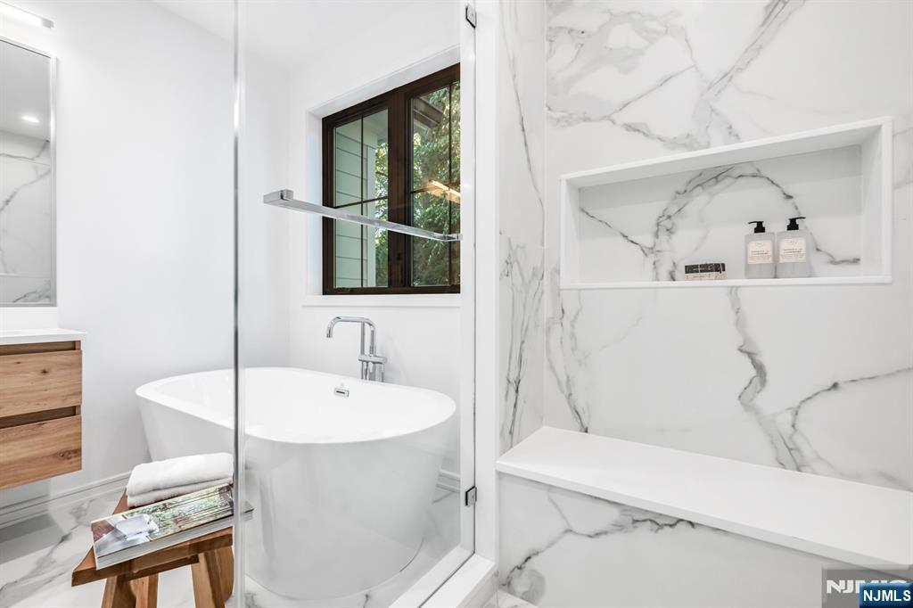 23 Fey Place Oradell, NJ 07649 - Photo 22 of 36 a bathroom with a sink and a mirror
