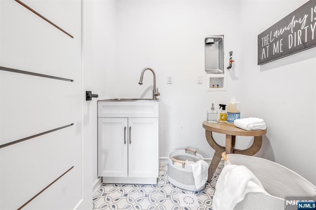 23 Fey Place Oradell, NJ 07649 - Photo 30 of 36 a bathroom with a sink toilet and a mirror
