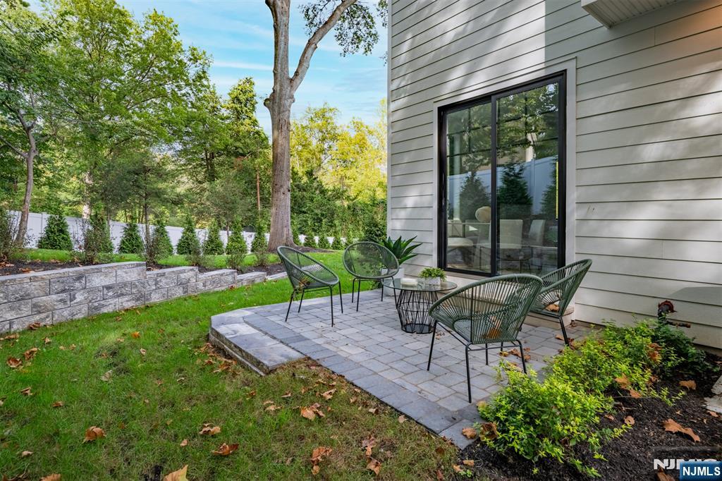 23 Fey Place Oradell, NJ 07649 - Photo 34 of 36 a view of a chair and table in backyard of the house
