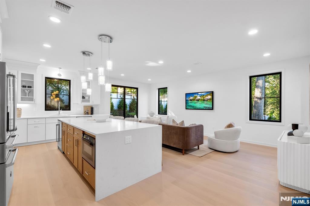 23 Fey Place Oradell, NJ 07649 - Photo 4 of 36 a large kitchen with a table and chairs