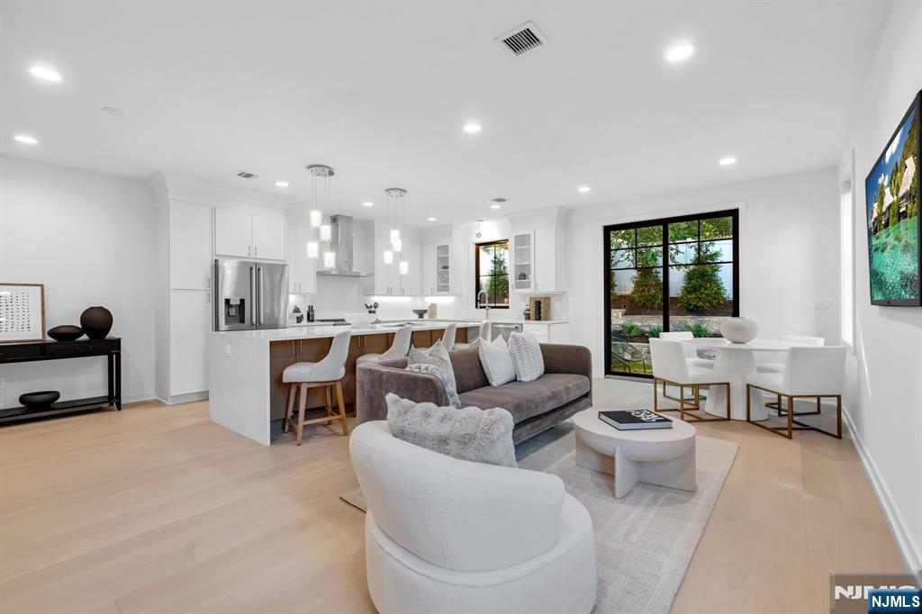 23 Fey Place Oradell, NJ 07649 - Photo 9 of 36 a living room with furniture and a large window