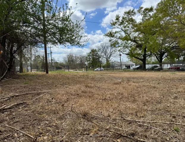 a view of a street with a building in the background