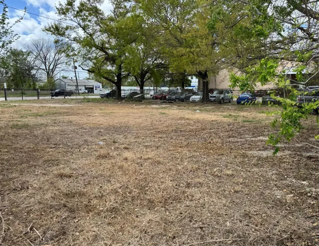 a swimming pool with outdoor seating and yard