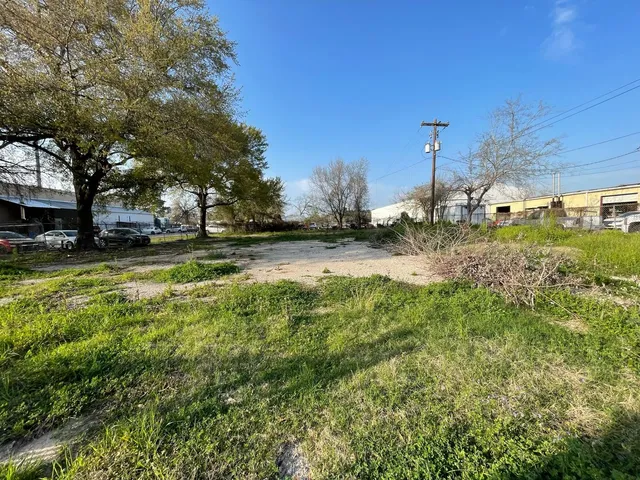 a view of a field with trees