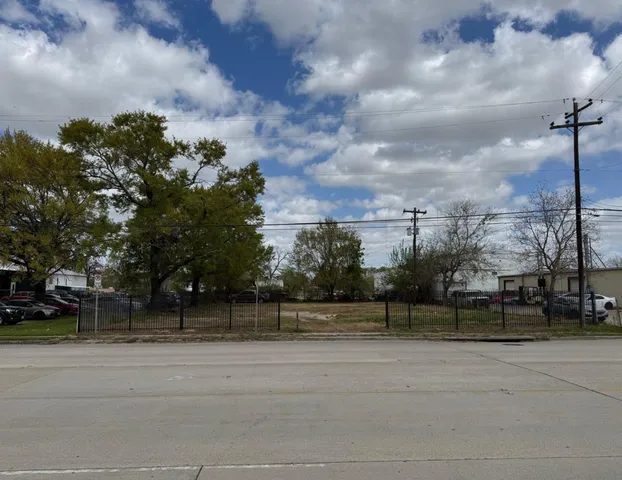 a view of outdoor space with signage and flags