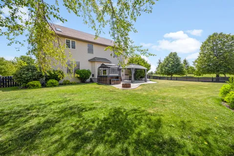 a view of a house with a yard porch and sitting area