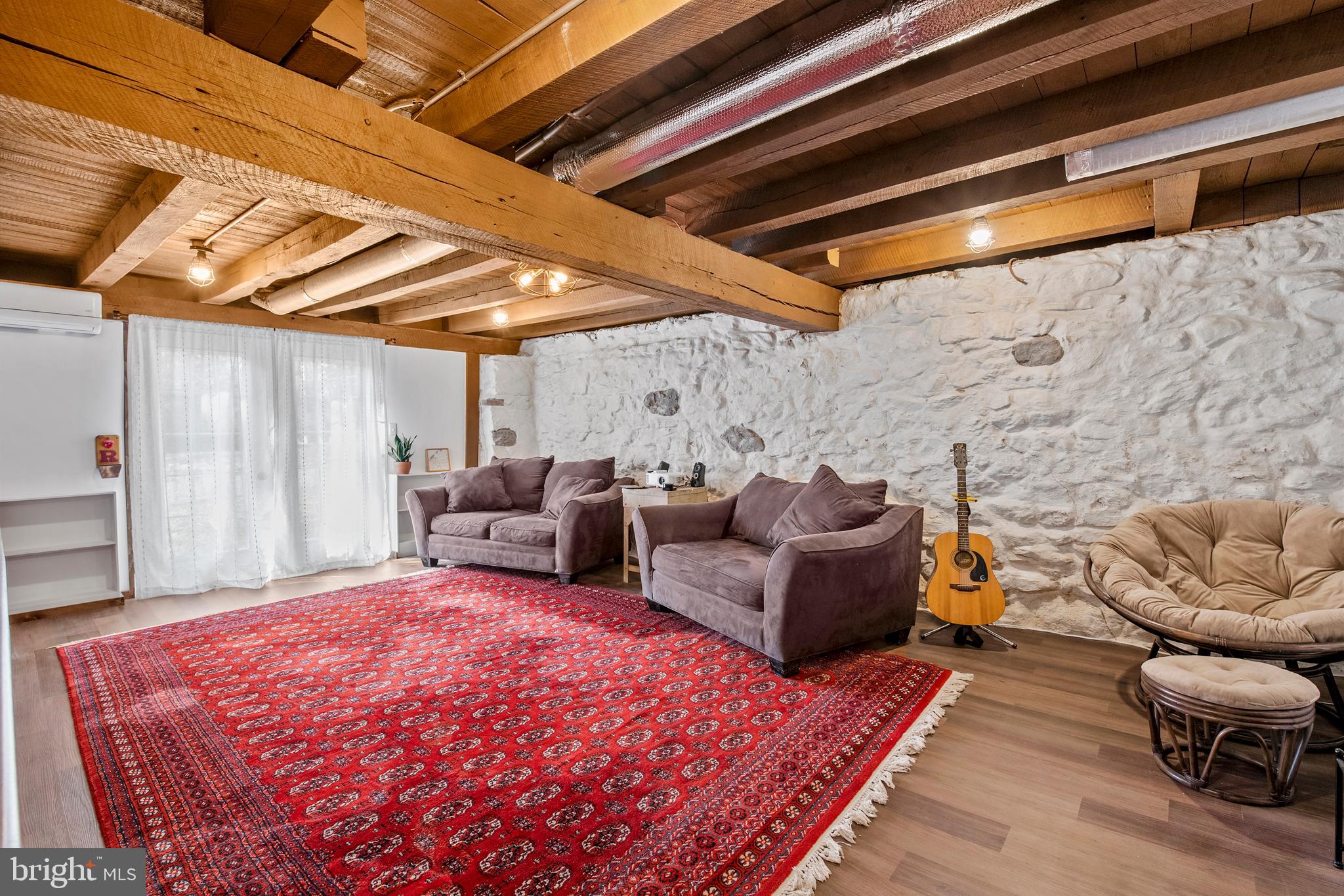 248 Warwick Road Elverson, PA 19520 - Photo 29 of 56 Family room with exposed beams