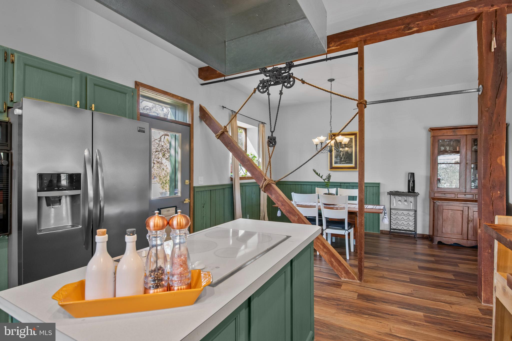 248 Warwick Road Elverson, PA 19520 - Photo 7 of 56 Exposed support beam divides kitchen/dining room