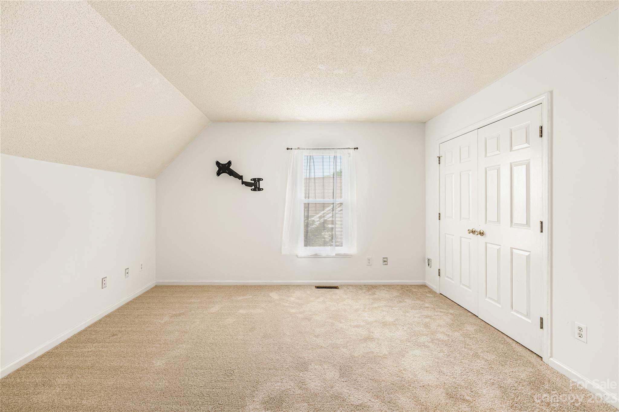 9504 Foggy Meadow Road Charlotte, NC 28269 - Photo 20 of 24 an empty room with a empty space and windows