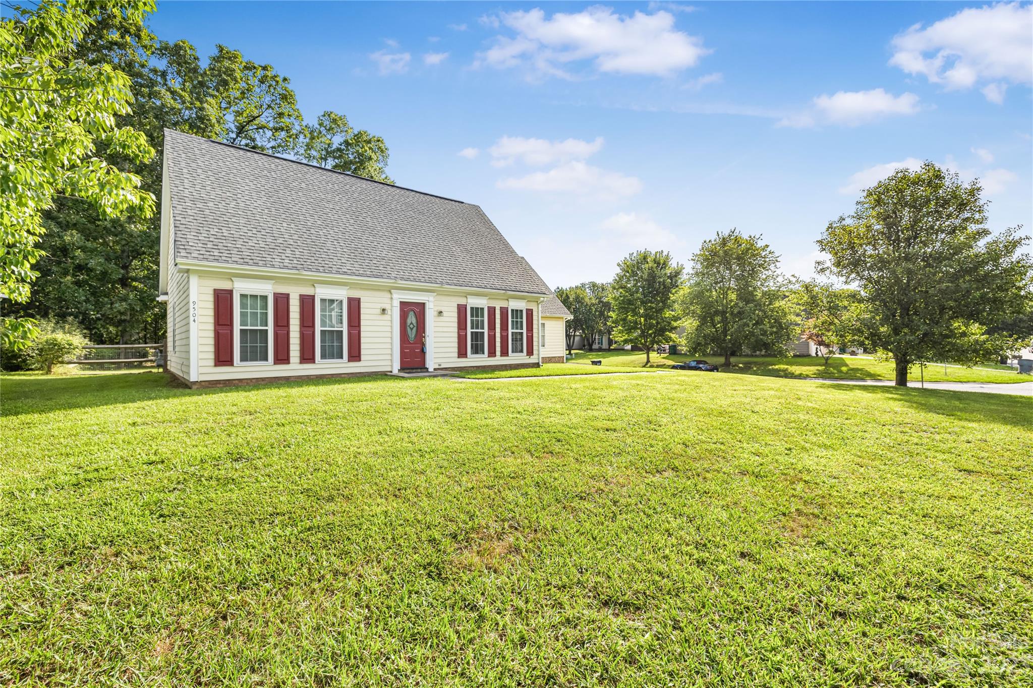 9504 Foggy Meadow Road Charlotte, NC 28269 - Photo 2 of 24 a house view with swimming pool and garden space